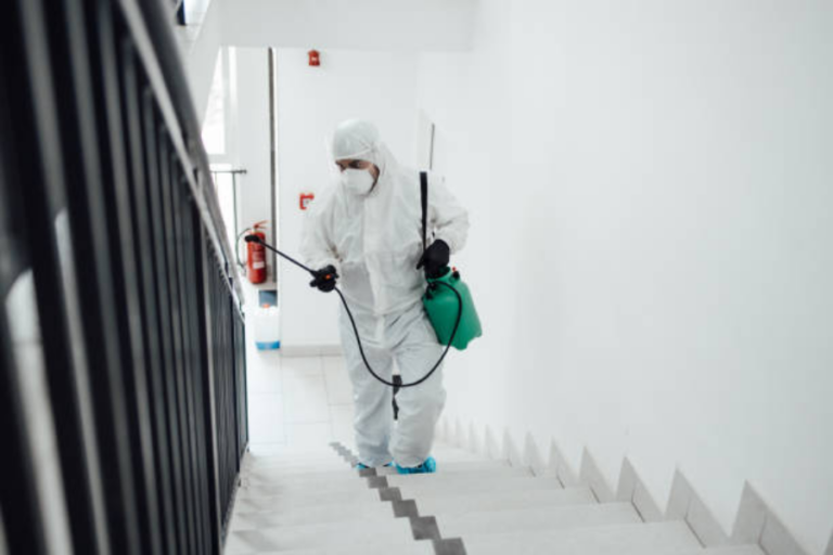 Pest control treating stairs in commercial properties.