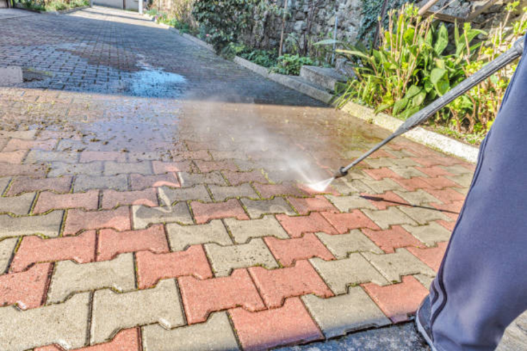 Professional cleaning the driveway.